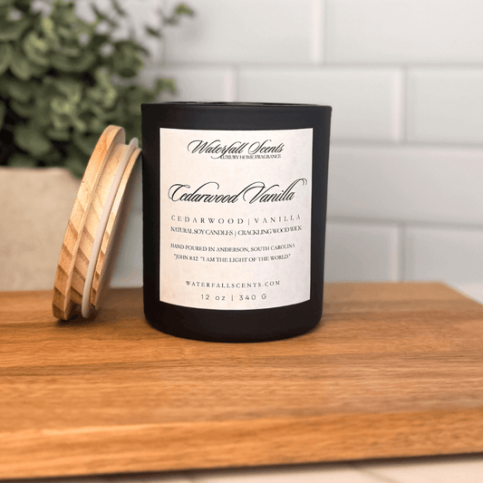 Cedarwood Vanilla wooden wick candle in a black glass jar with a white label. Hand poured, non-toxic, and clean burning with a warm, masculine scent.