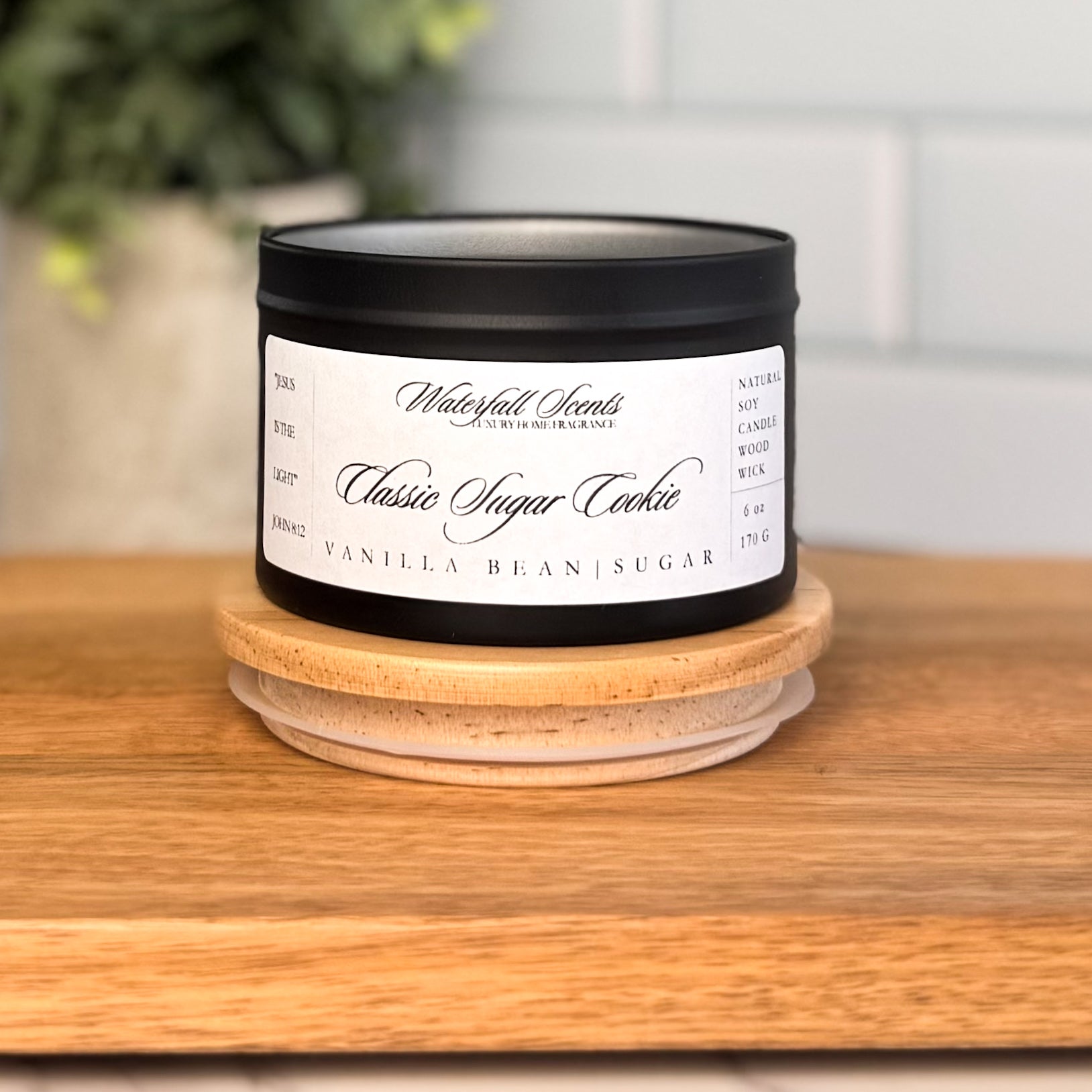 Classic Sugar Cookie wooden wick candle in a black travel tin with a white label. Clean burning, hand poured, non-toxic candle with warm vanilla sugar cookie scent.