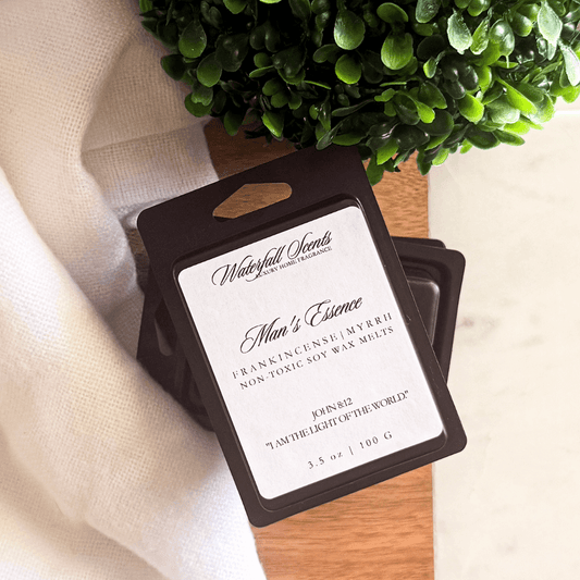 Man’s Essence black clamshell natural wax melts with frankincense, myrrh, oud, and musk for wax melt warmers.