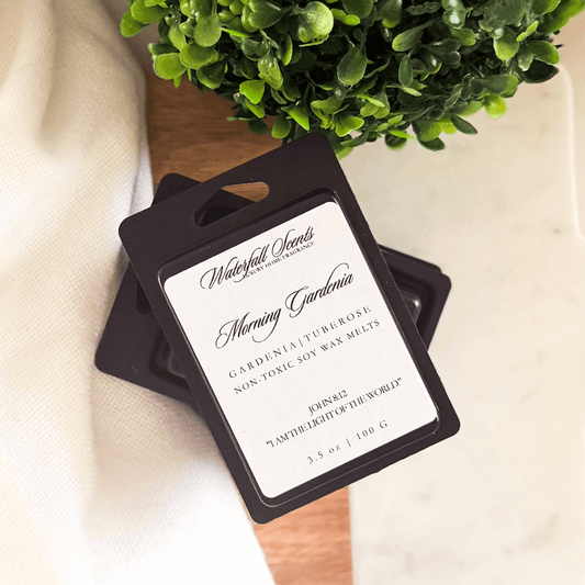 Morning Gardenia black clamshell natural wax melts with gardenia, lemon peel, jasmine, tuberose, and green floral for wax melt warmers.