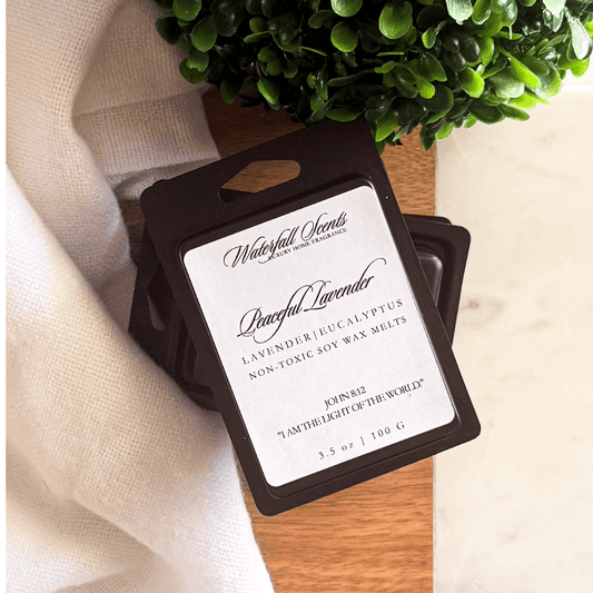 Black clamshell natural wax melts in Peaceful Lavender scent with lavender, eucalyptus, and bergamot, perfect for wax melt warmers.