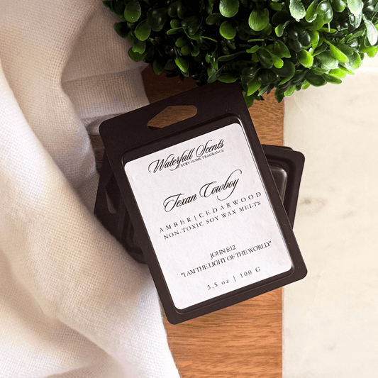 Black clamshell wax melts in Texan Cowboy scent with leather, smoked cedar, amber, vetiver, and musk – bold, masculine non-toxic wax melts.