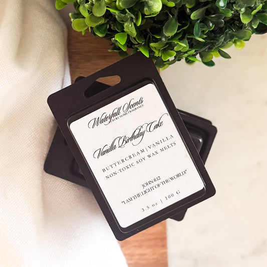 Vanilla Birthday Cake wax melts in a sleek black clamshell. Clean burning, hand poured melts with sweet vanilla cake and sugary frosting scent.