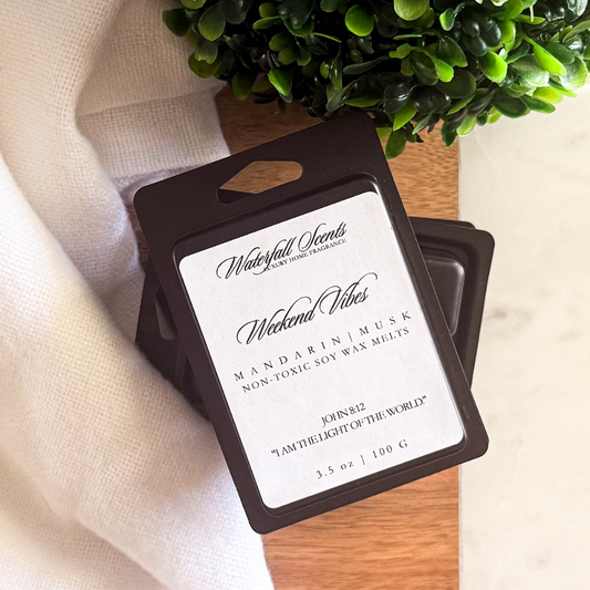 Weekend Vibes black clamshell natural wax melts with mandarin, magnolia, amber, and musk for wax melt warmers.