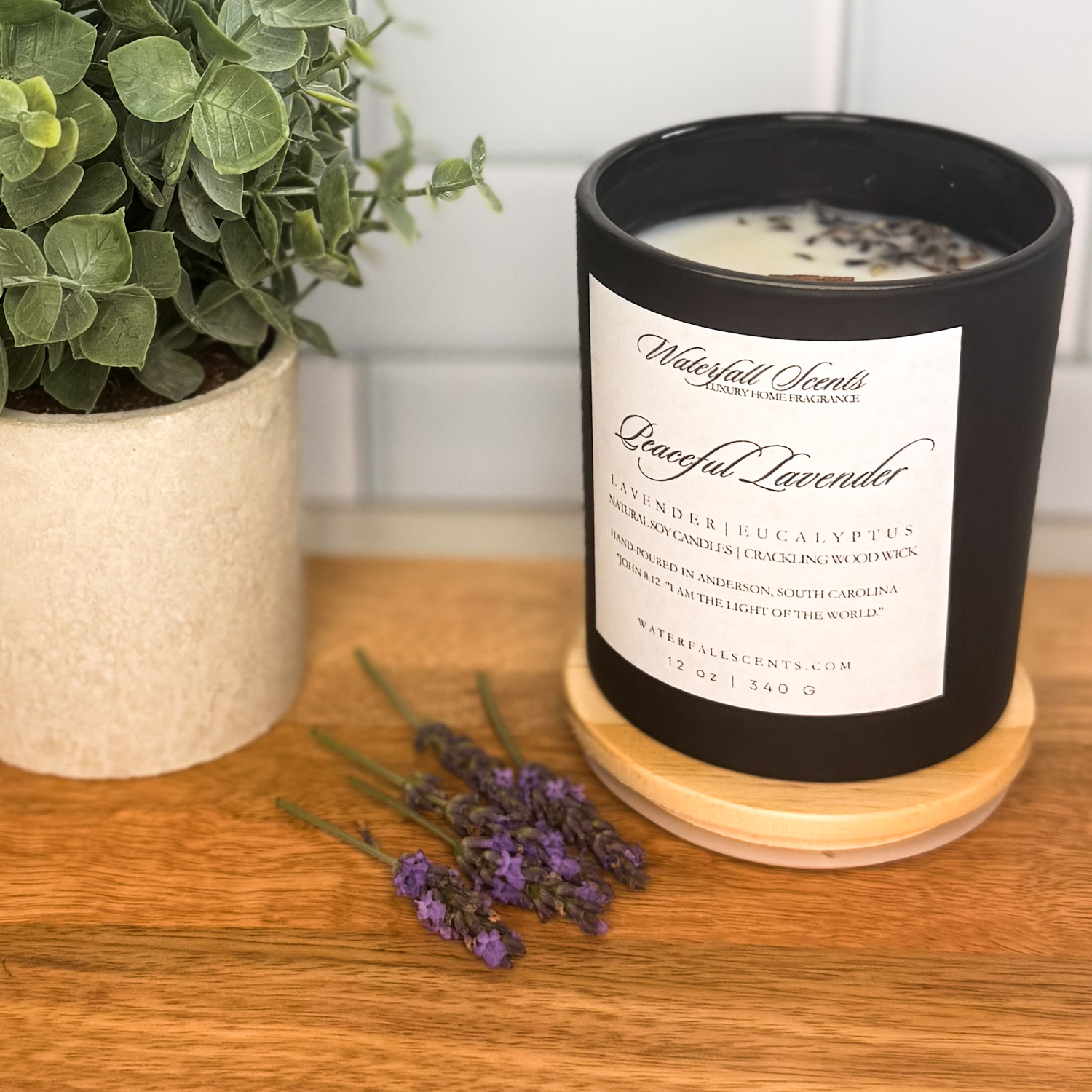 Fresh & Floral hand poured candle in black glass jar with wooden wick, clean burning and made in Anderson, SC.