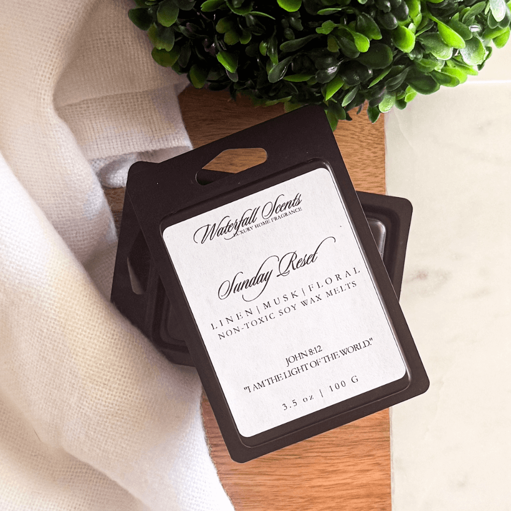 Sunday Reset black clamshell natural wax melts with lemon, linen, green floral, and light musk for wax melt warmers.