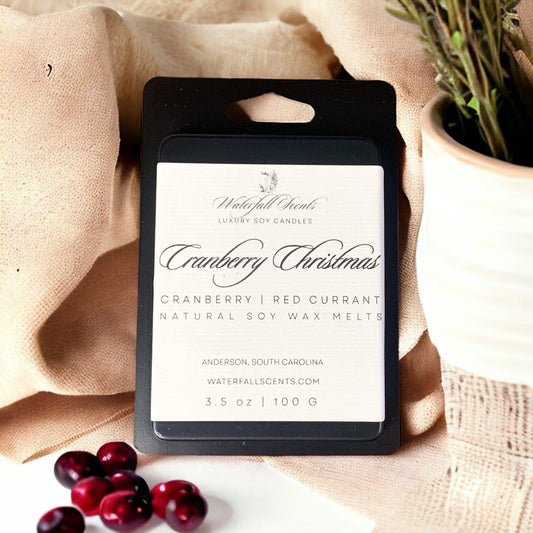 cranberry christmas soy wax melts in a matte black clamshell