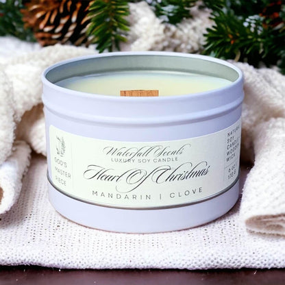 Matte white travel tin candles capturing the festive magic of Heart Of Christmas, enhanced by a wooden wick for a portable and heartwarming holiday glow.