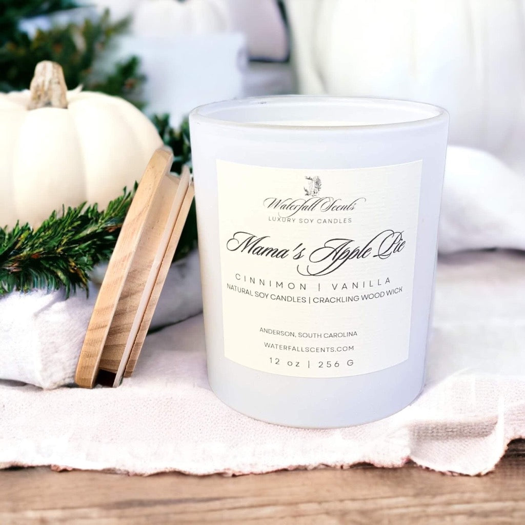 Mama's Apple Pie Wooden Wick Candles - Experience the comforting aroma of freshly baked apple pie with these handcrafted candles, perfect for a cozy atmosphere. Comes in White Glass Vessel