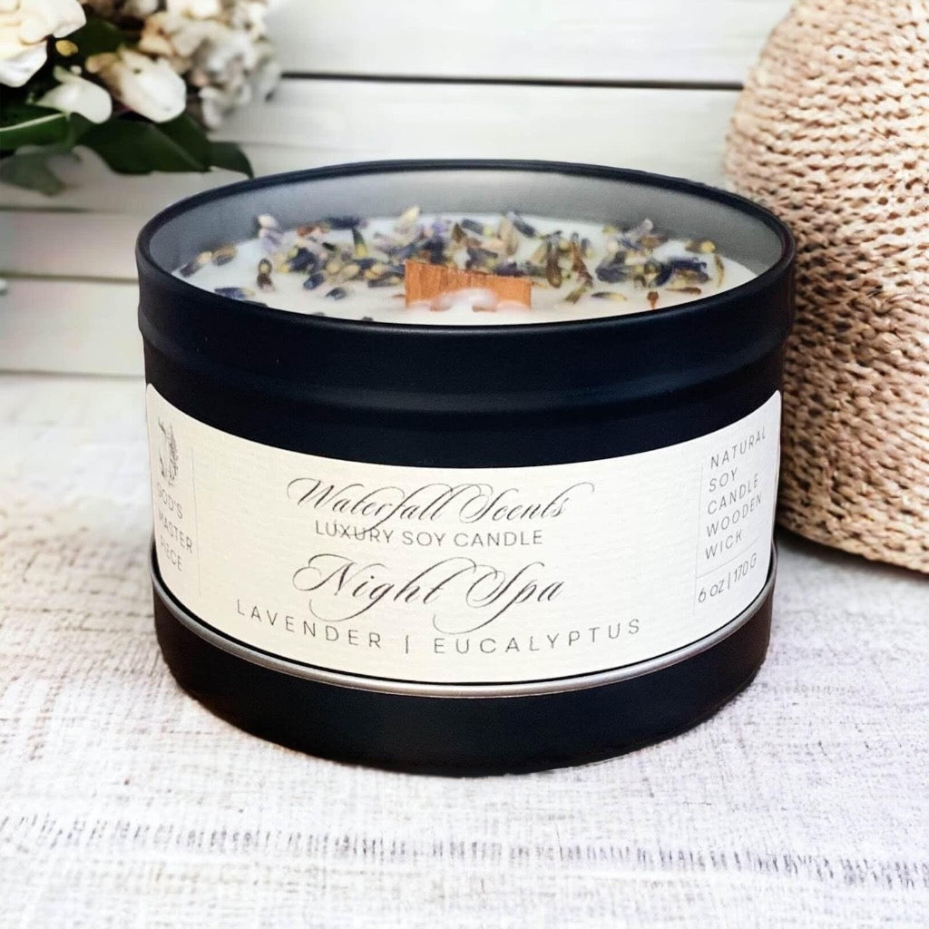 imagine a cozy living room with a lit Night Spa Wooden Wick Candle, creating a soothing ambiance with soft music playing in the background. Perfect for busy women in need of relaxation. comes in black tin vessel