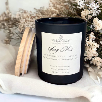Sexy Man Wooden Wick Candles - A seductive collection of handcrafted candles, perfect for creating a romantic ambiance and igniting passion. Comes in a black glass vessel.