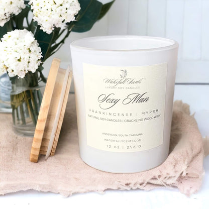 Sexy Man Wooden Wick Candles - A seductive collection of handcrafted candles, perfect for creating a romantic ambiance and igniting passion. Comes in a white glass vessel.