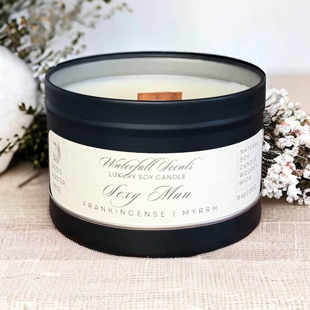 Sexy Man Wooden Wick Candles - A seductive collection of handcrafted candles, perfect for creating a romantic ambiance and igniting passion. Comes in a black tin vessel.